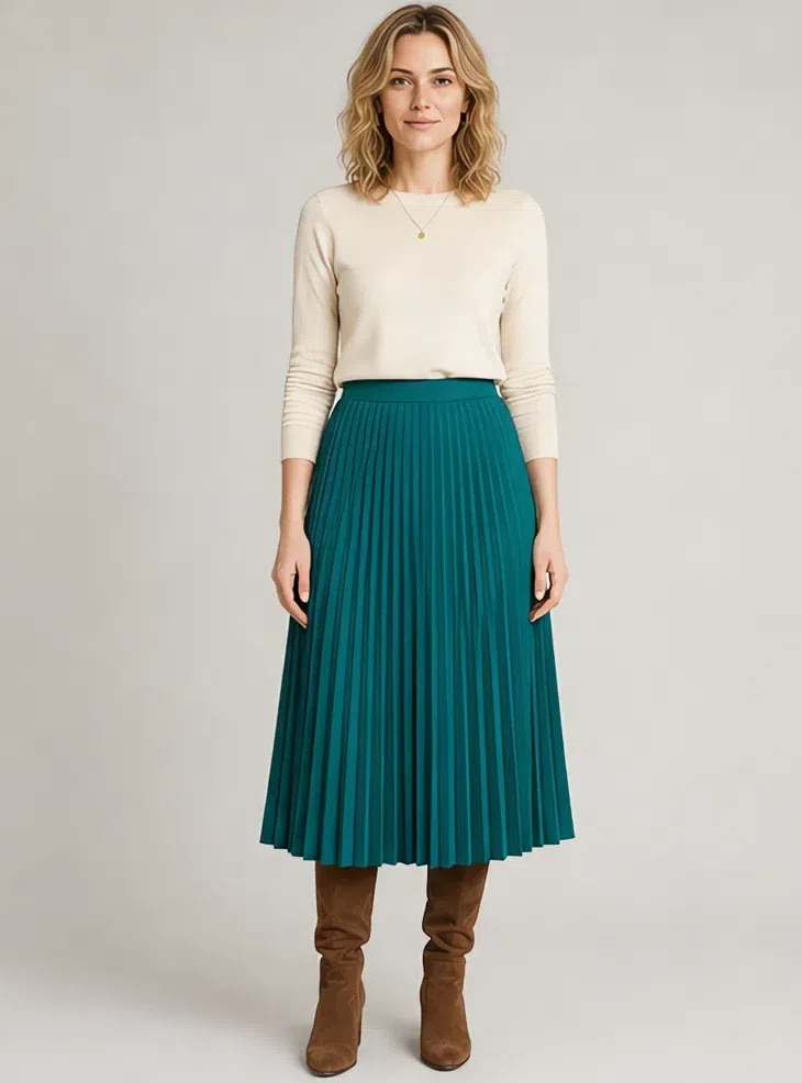 Teal pleated midi skirt with a cream top, Fair complexion