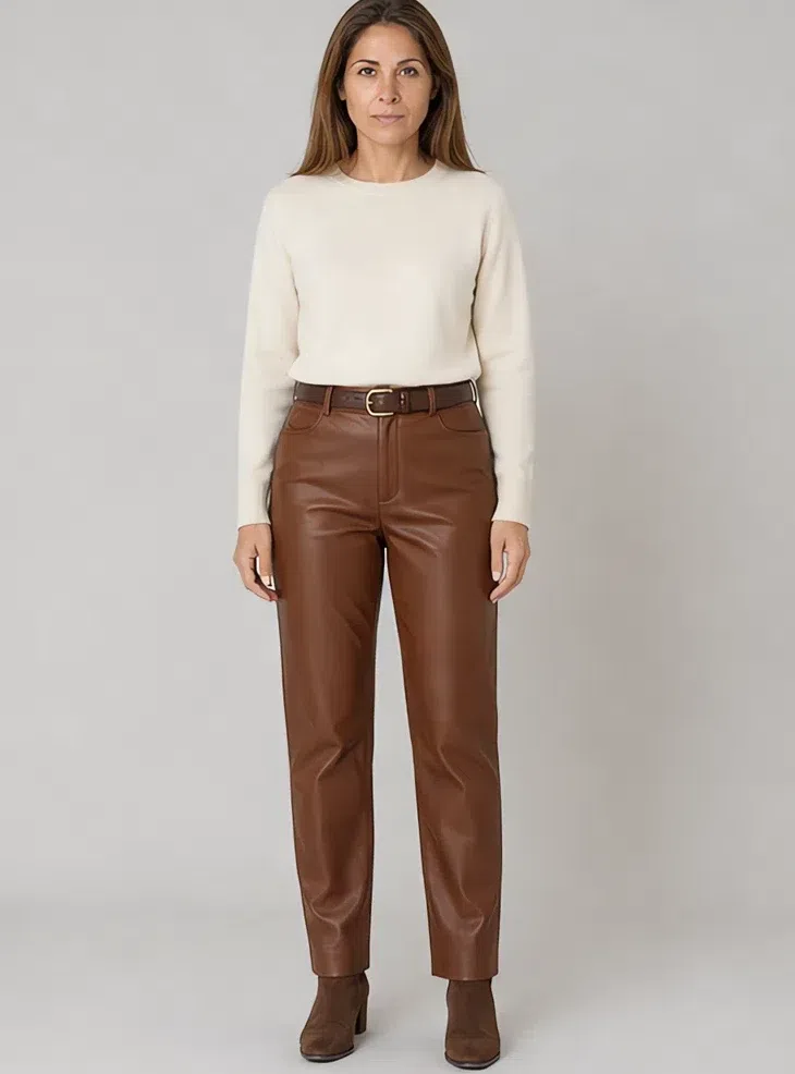 Russet leather trousers with a cream knit tucked in, Light complexion