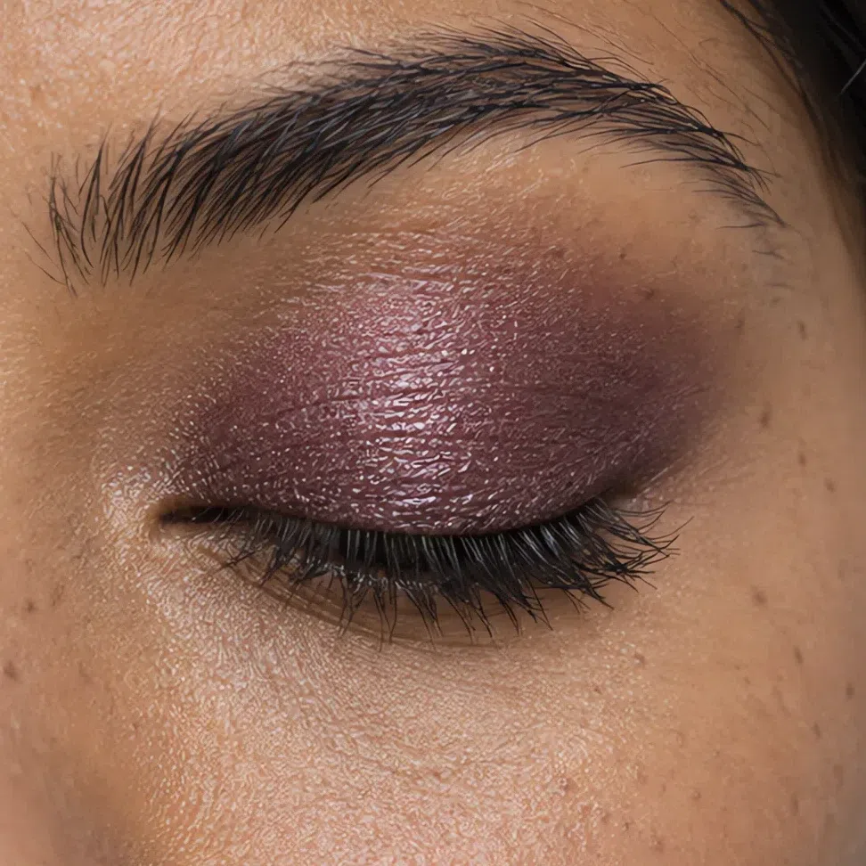 Plum night shadow across the lid, blended out at the crease