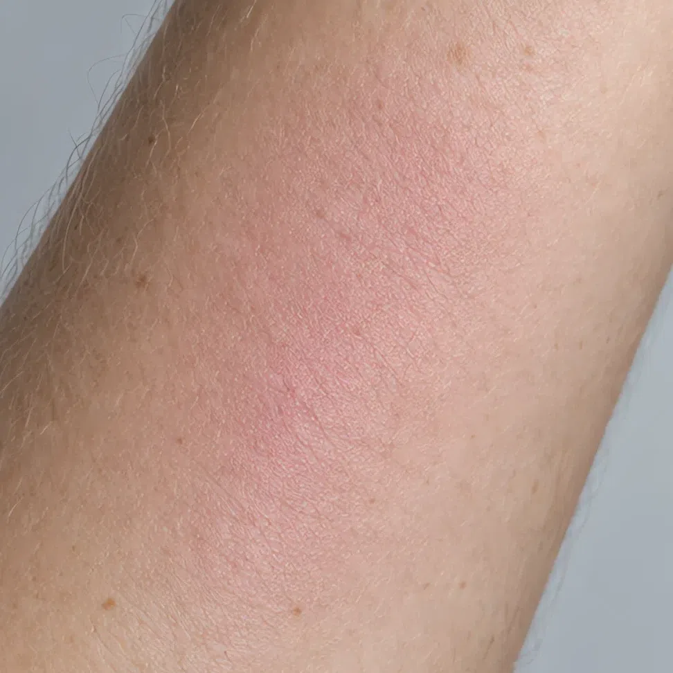 The same blush blended into the forearm under soft daylight