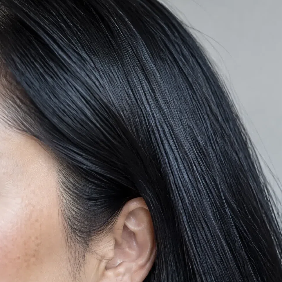 Straight raven-black Cool Winter hair with a blue-violet sheen