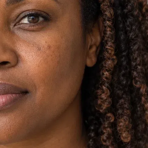 Copper-brown foundation matched to deep brown skin