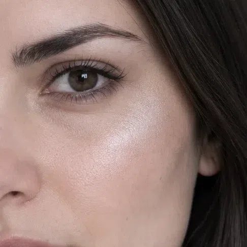 Icy silver highlighter on a fair Deep Winter complexion