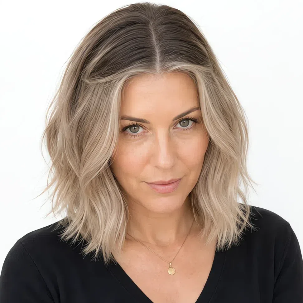 Ash blonde grown out with a sharp regrowth band at the scalp