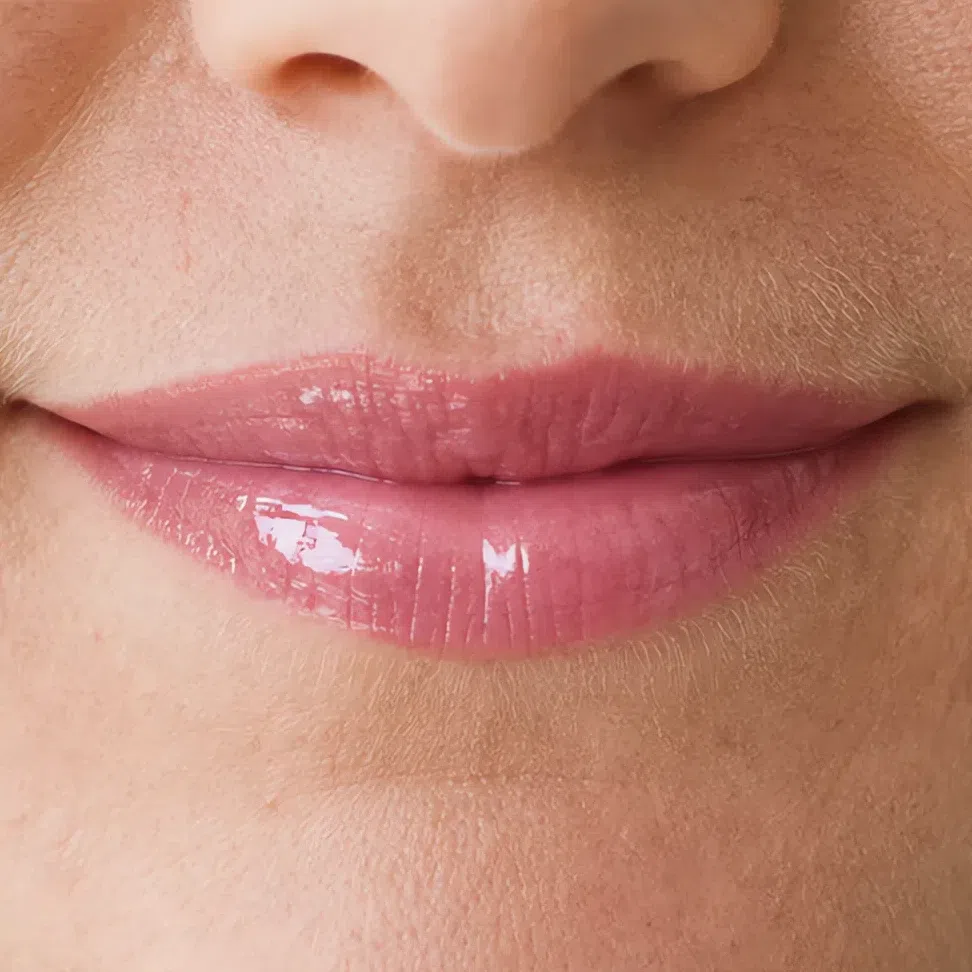 The same lipstick in a high-gloss finish with a hard specular highlight