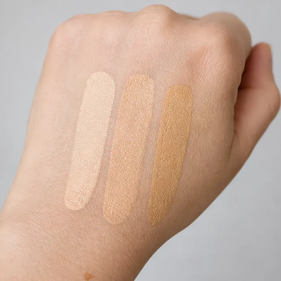 The same three shades swatched on the back of the hand where all three look fine