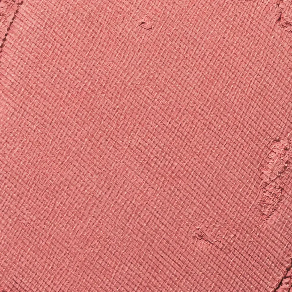 The same cool rose blush photographed in its pan, looking more saturated and warmer