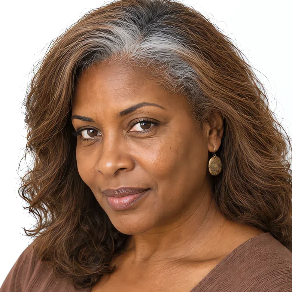 The same woman mid-transition, silver regrowth against a warm brown length