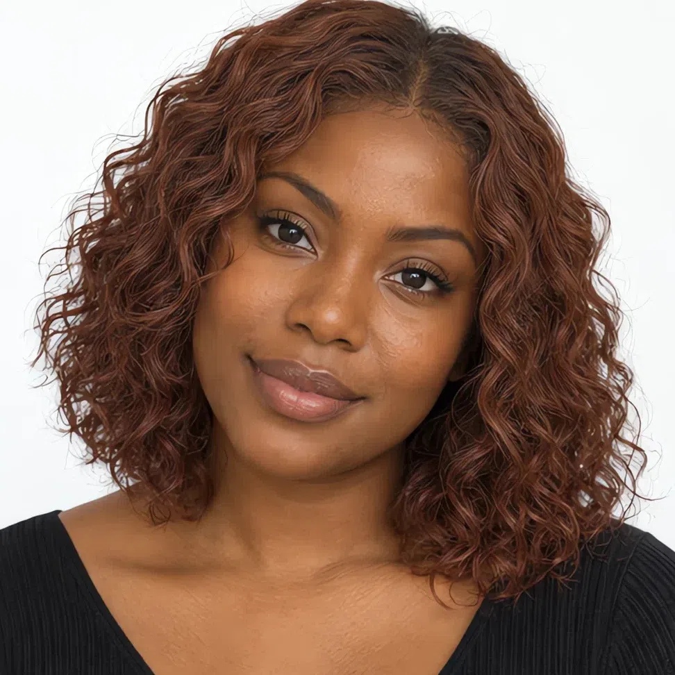 A Soft Autumn woman with deep warm-brown skin and muted auburn hair