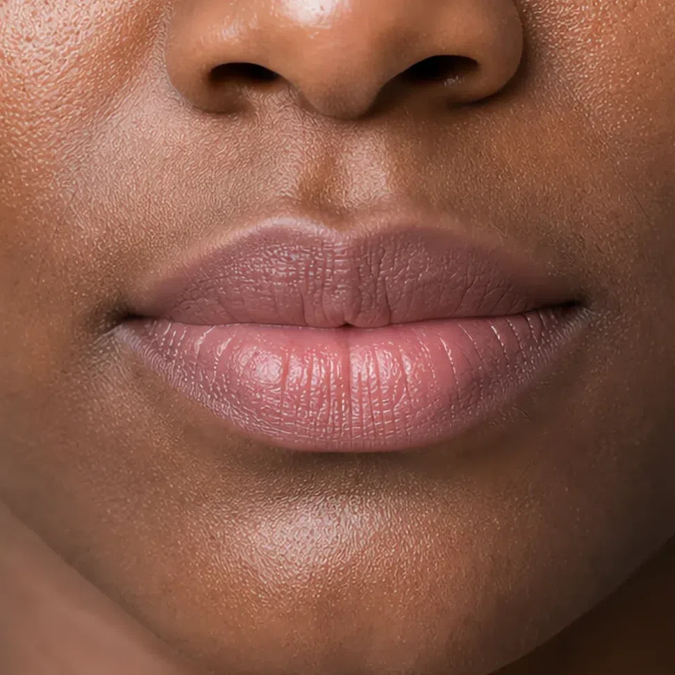 Soft Summer daytime lip makeup on a deep complexion