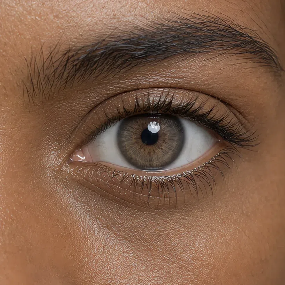 Soft gray-brown Soft Summer eye on a deep complexion