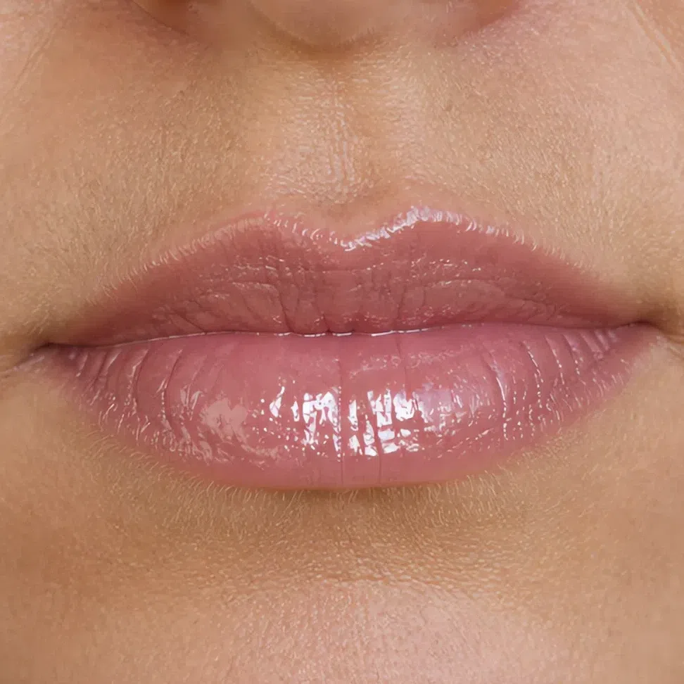 The same lipstick in a high-gloss finish with a hard specular highlight