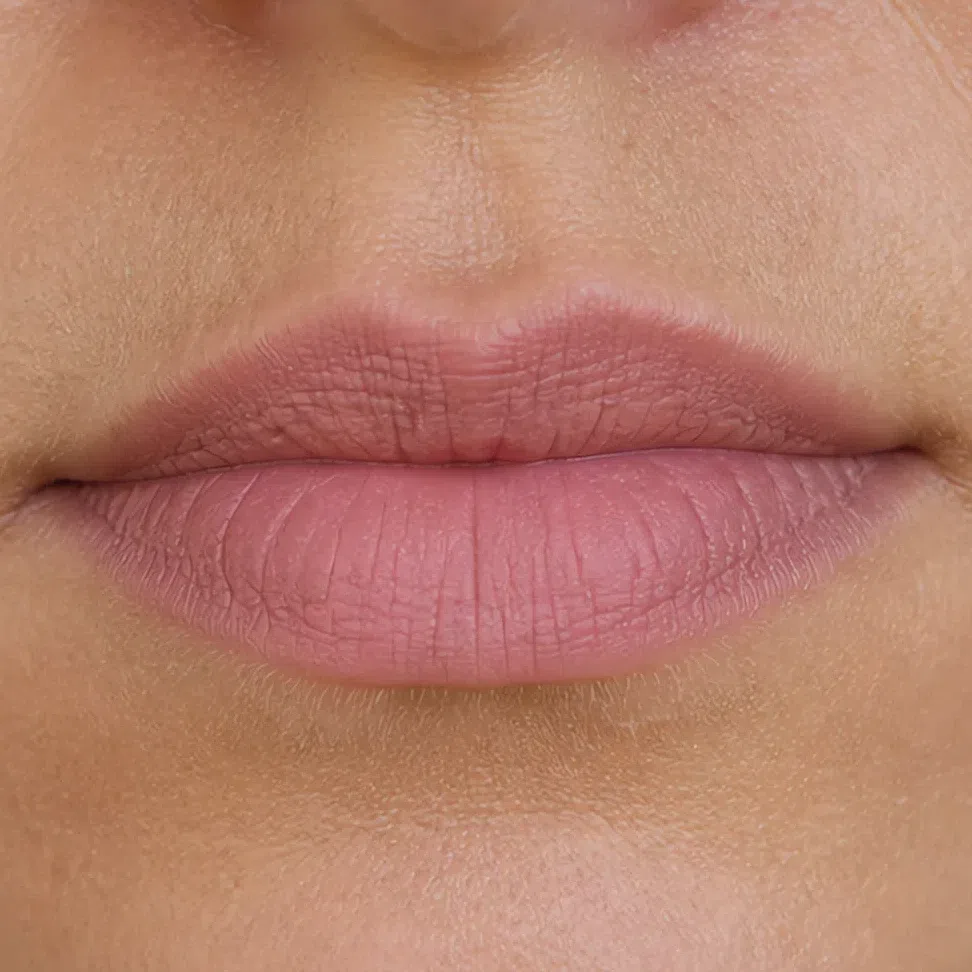A muted dusty rose lipstick in a flat matte finish