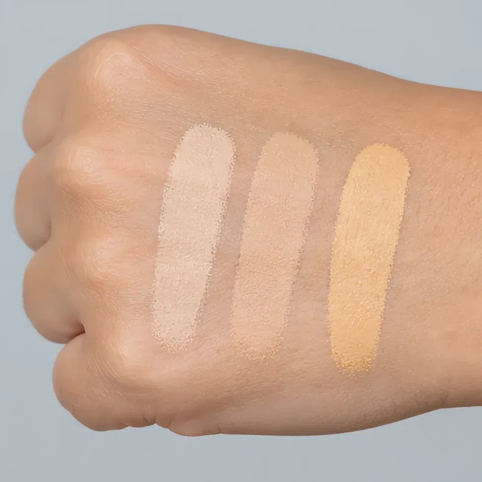 The same three shades swatched on the back of the hand where all three look fine