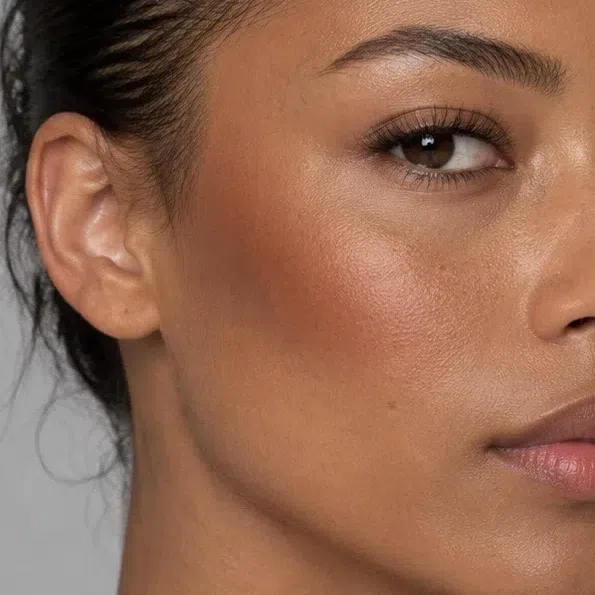 Terracotta bronzer on medium golden-bronze skin