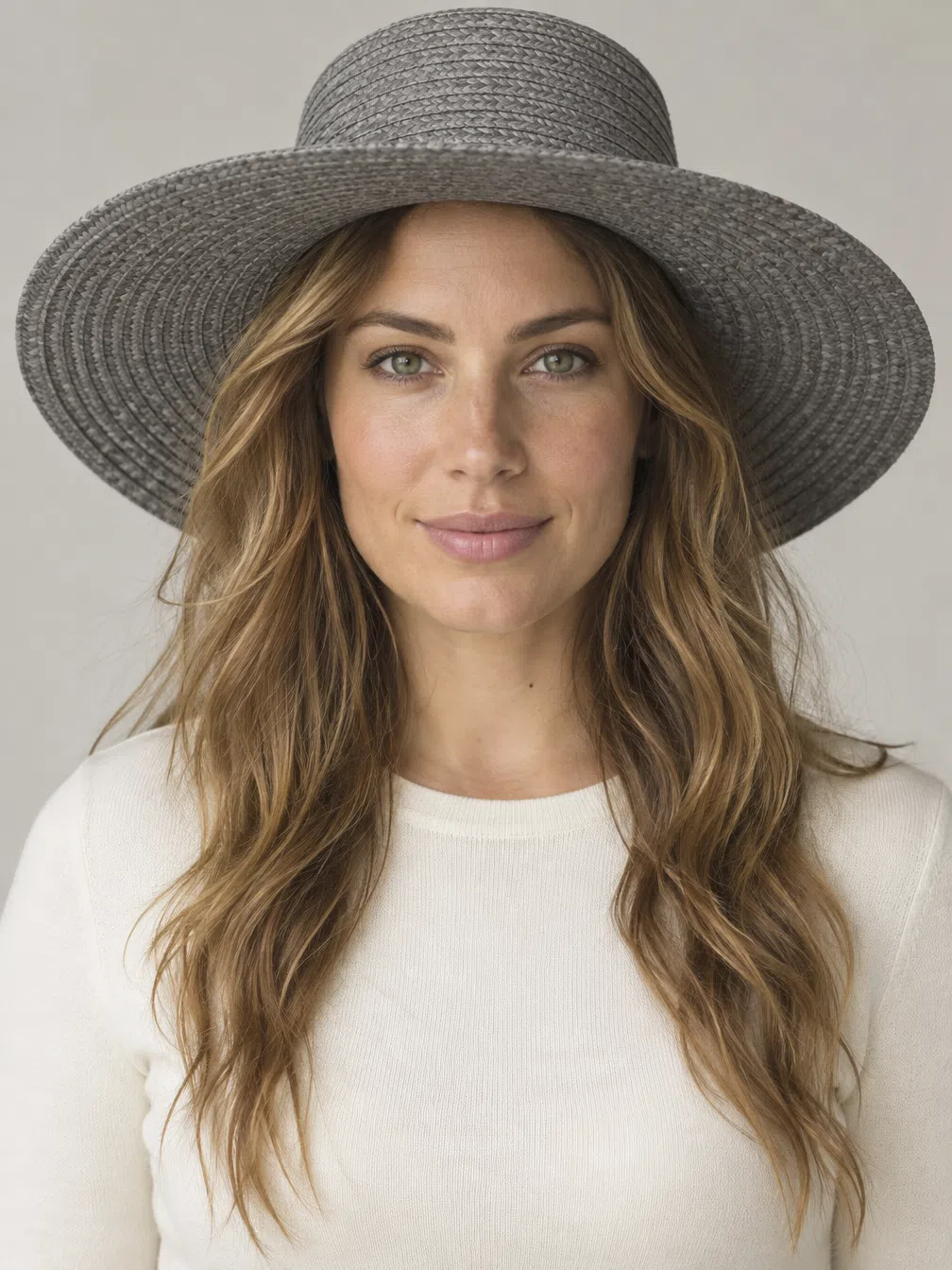 A wide-brim sun hat recolored through Warm Spring accents over a neutral knit