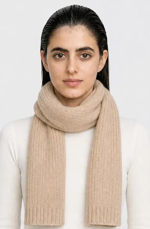 A Deep Autumn accent painted onto a knitted scarf while the sweater underneath stays ecru in Tomato