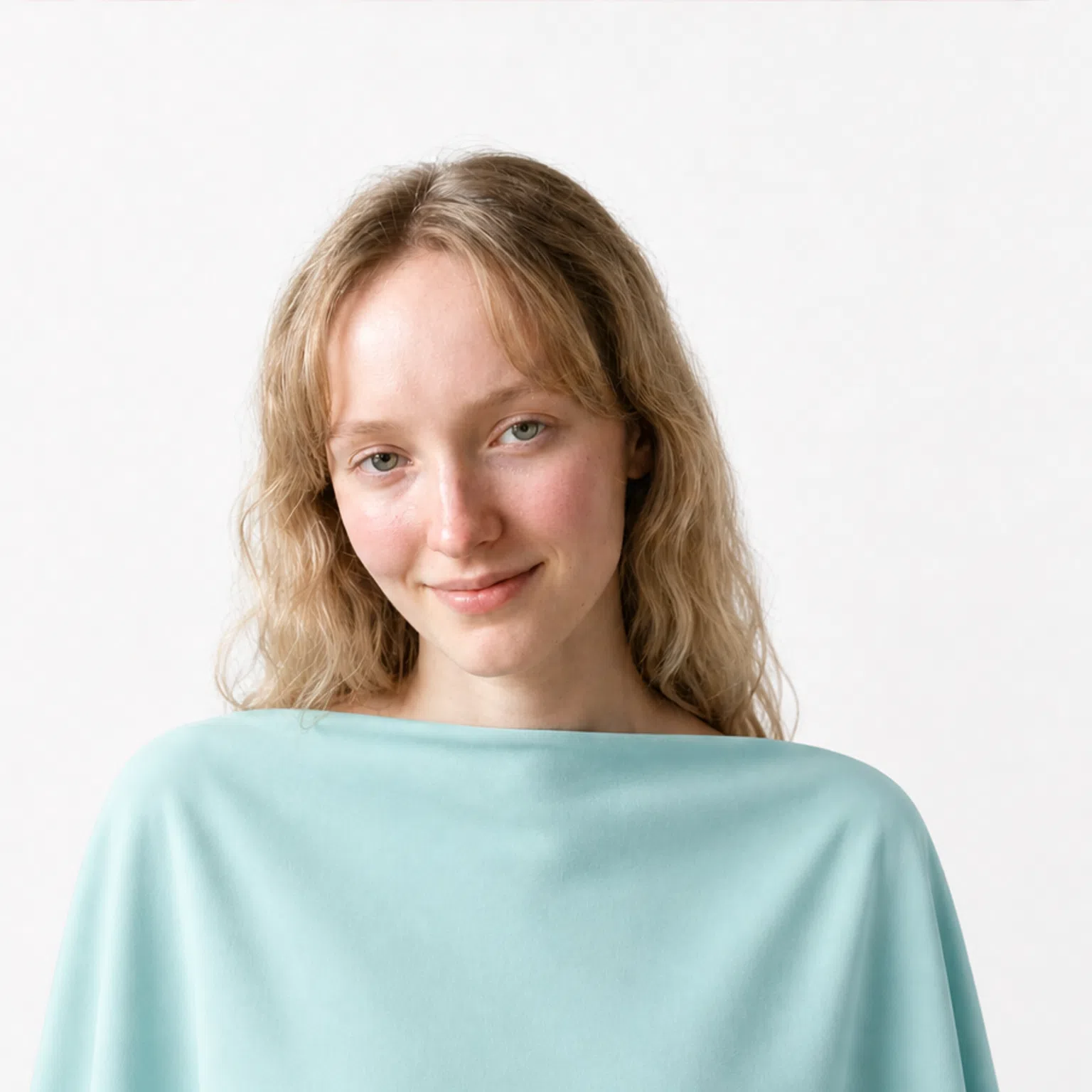 Light coloring - a model in an aqua mint drape